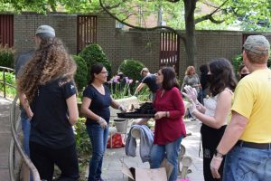 many people working in plant garden