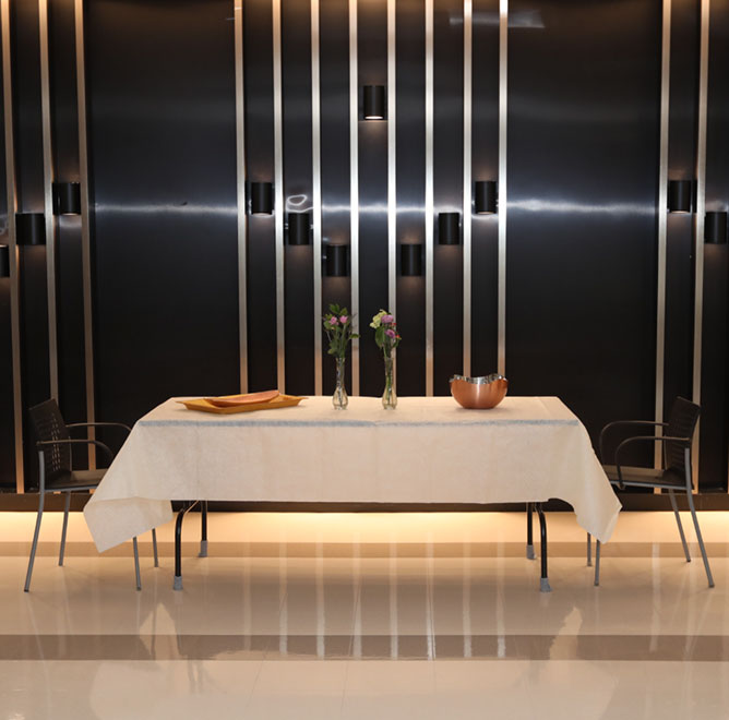 Beautiful table setting in front of black wall
