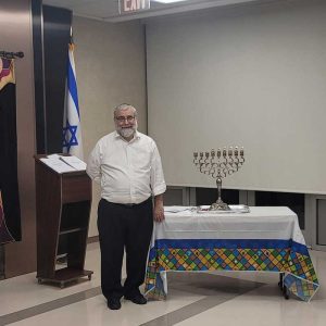 Rabbi Pearlman celebrating Chanukah at Margaret Tietz