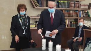 Margaret Tietz employees light candles at Yom Hashoah