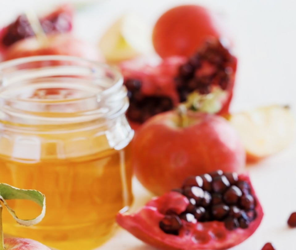 close up of honey and fruit