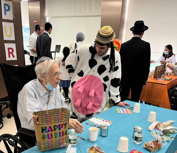 An LCM student speaks to a resident at Margaret Tietz.