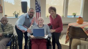 Veteran Joel Zamisky is thanked by Ricardo Sola and Linda Spiegel