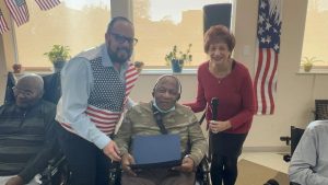 Air Force veteran Franklin Martin is thanked by Ricardo Sola and Linda Spiegel.